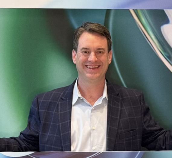 Graduating students hug each other at Commencement.